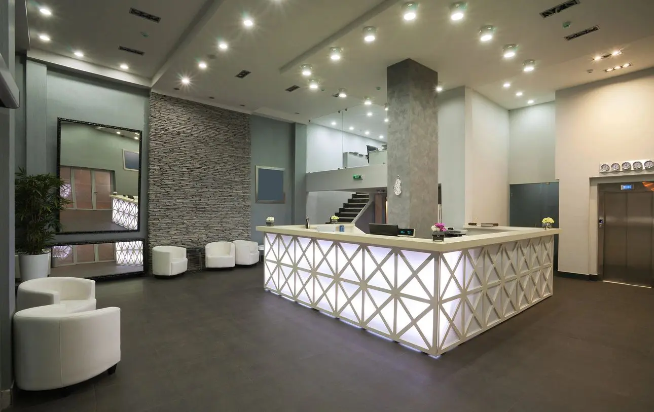 A reception area with a large white counter.